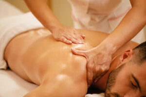 Men is Having a Relaxing Deep Tissue Massage Therapy