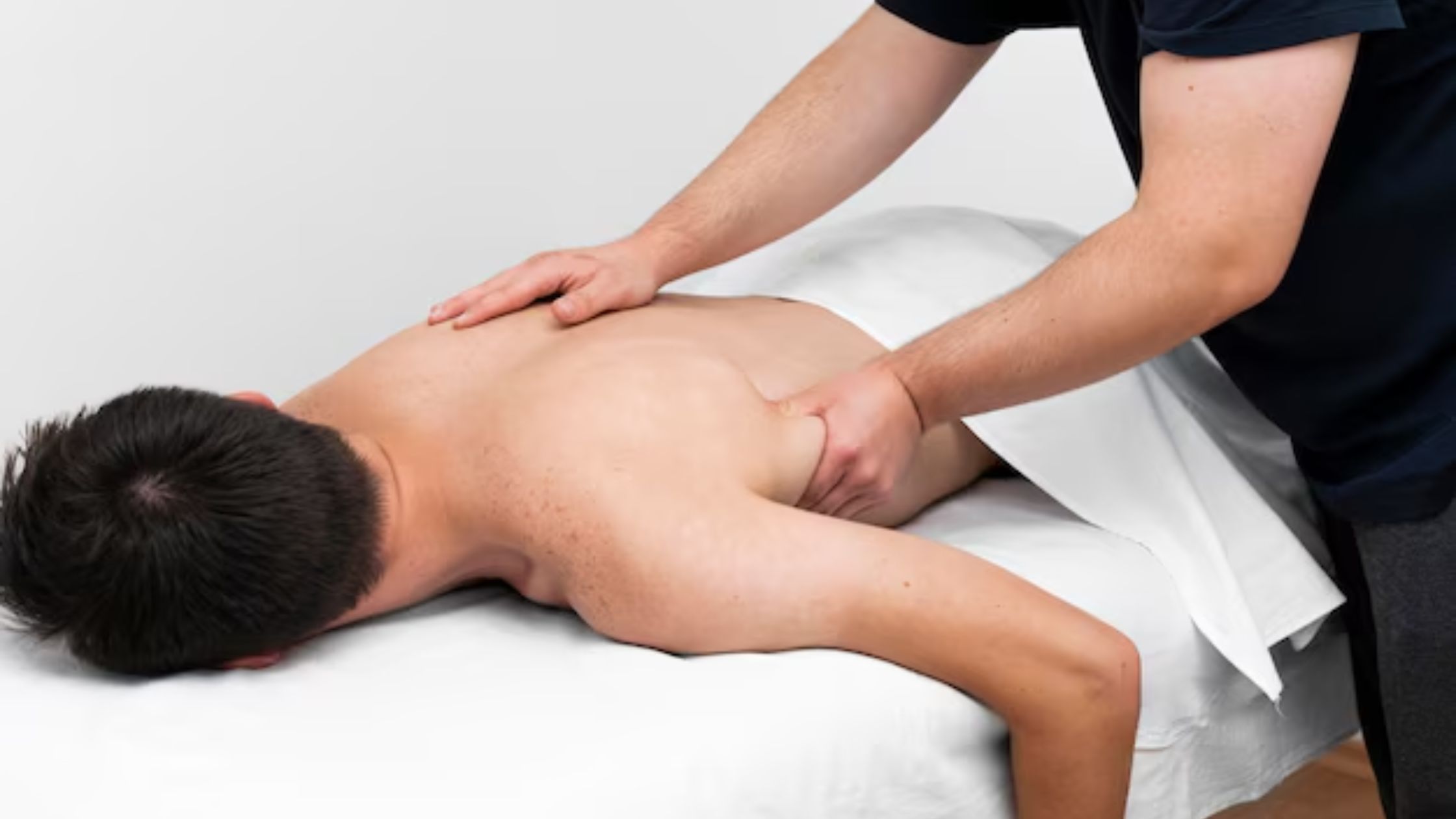 A man Having a Deep Tissue Massage Therapy