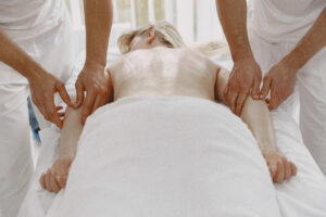 two hand massage therapy session by single therapist